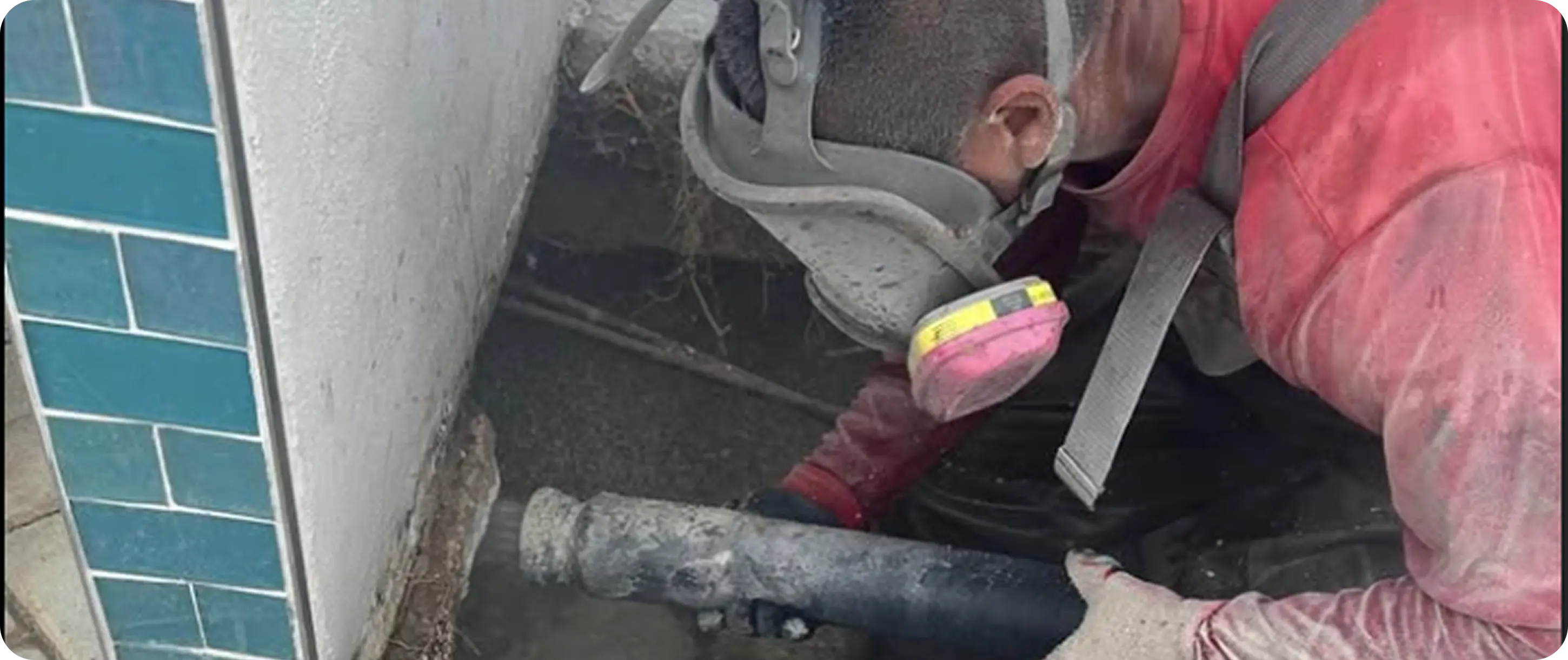 Technician handling pipe equipment